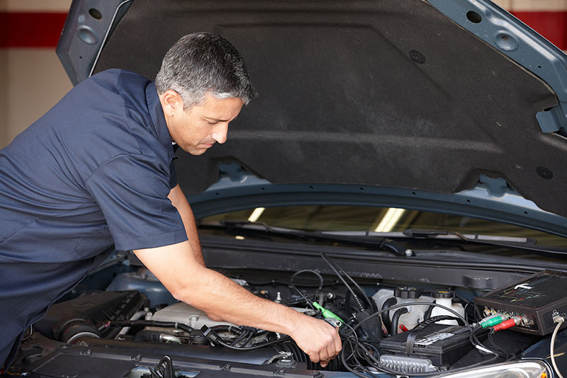 Person Checking Car Engine
